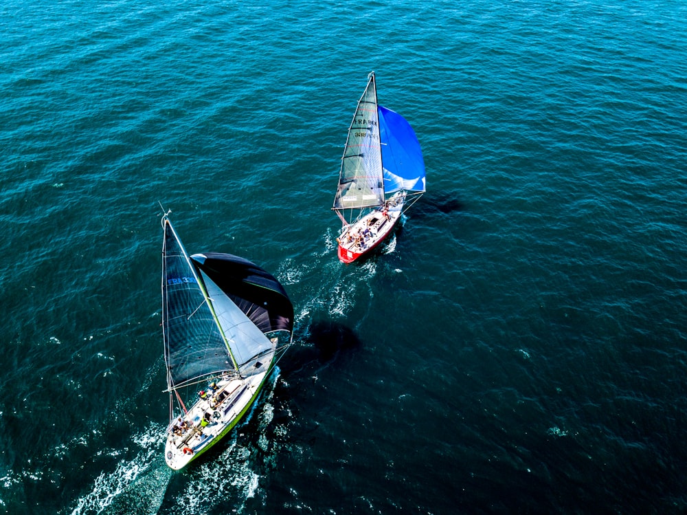 people riding on boats in high-angle photo