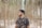 shallow focus photo of man in black and pink floral button-up T-shirt