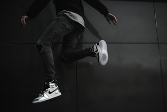 A dynamic shot of a sneaker enthusiast trying on new Jordans.