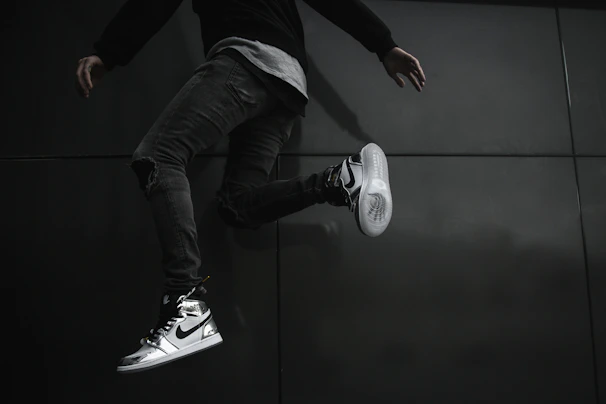 A dynamic photo of a man wearing sporty Nike apparel in an urban setting.