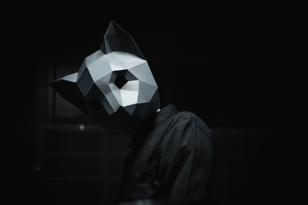person wearing gray mask