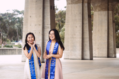 Smiling models celebrating their graduation from the biomodels academy.