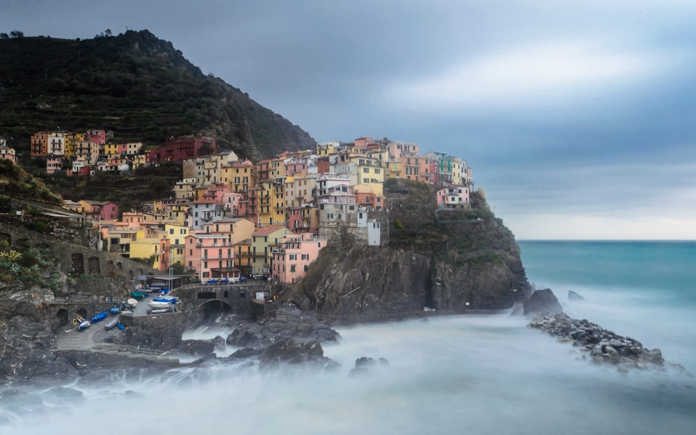 multicolored houses on rock cliff