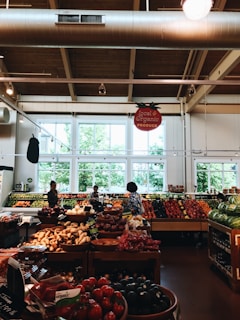 group of people inside mart at fruit section