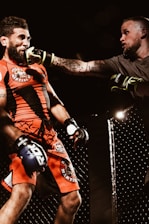 two men playing UFC inside ring