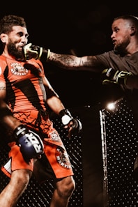 two men playing UFC inside ring
