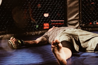 MMA Fighter Knocked Out Laying On Canvas