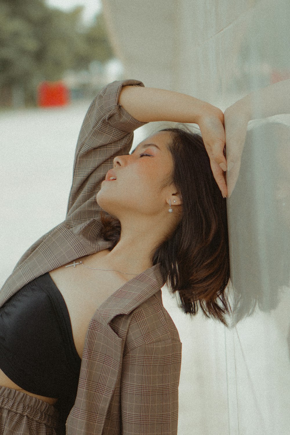 woman leaning on wall