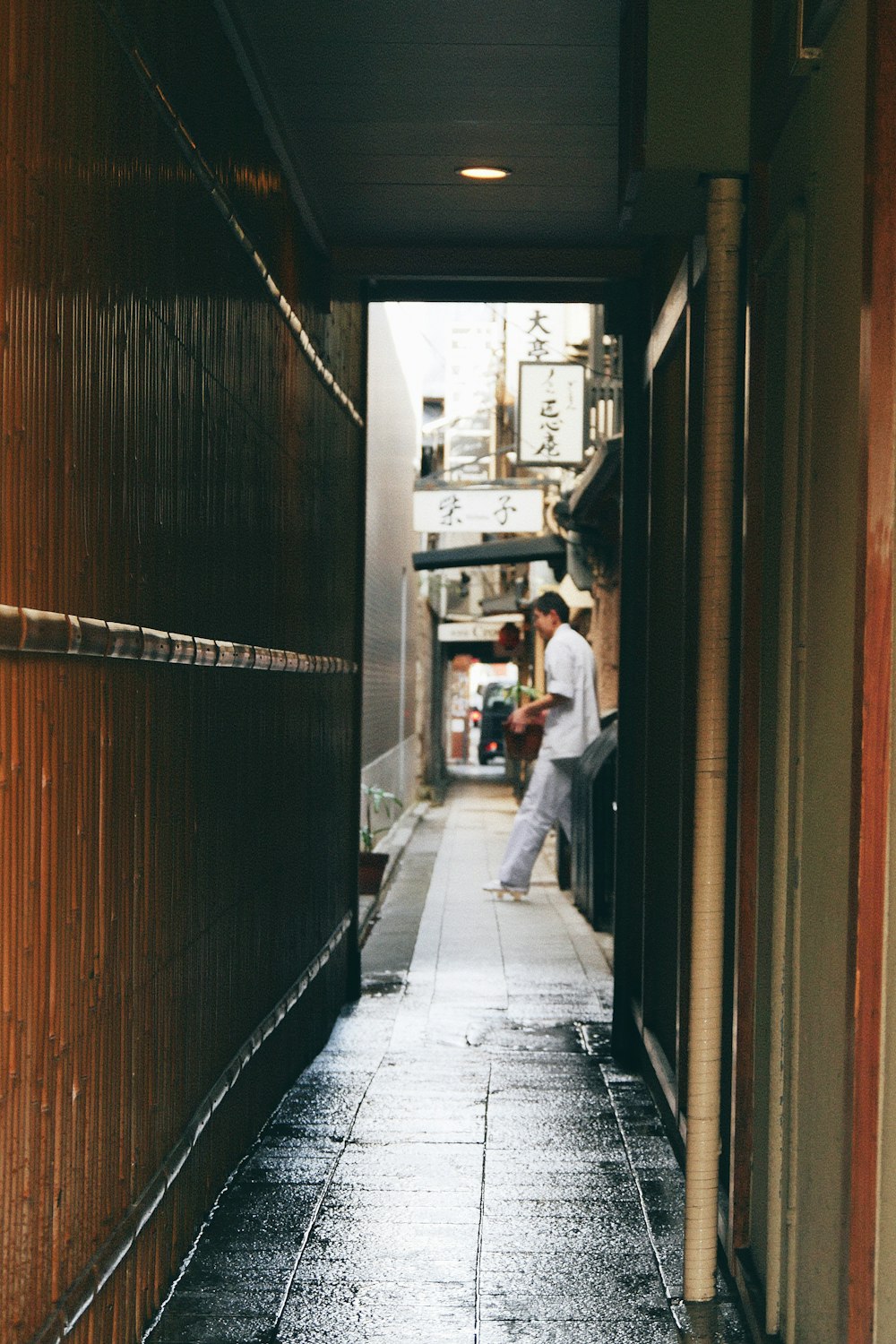 man leaning on wall during daytime