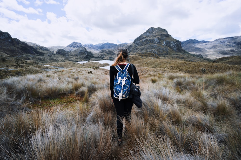 woman standing near the grass