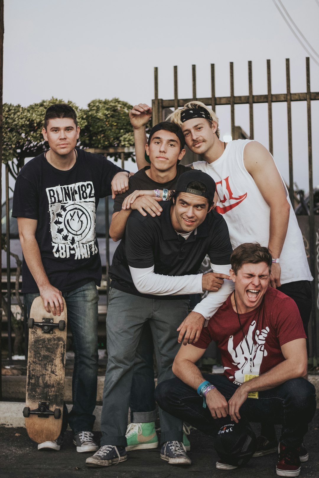 group of men standing near gate