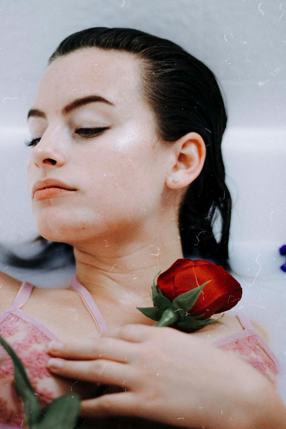 woman holding red rose