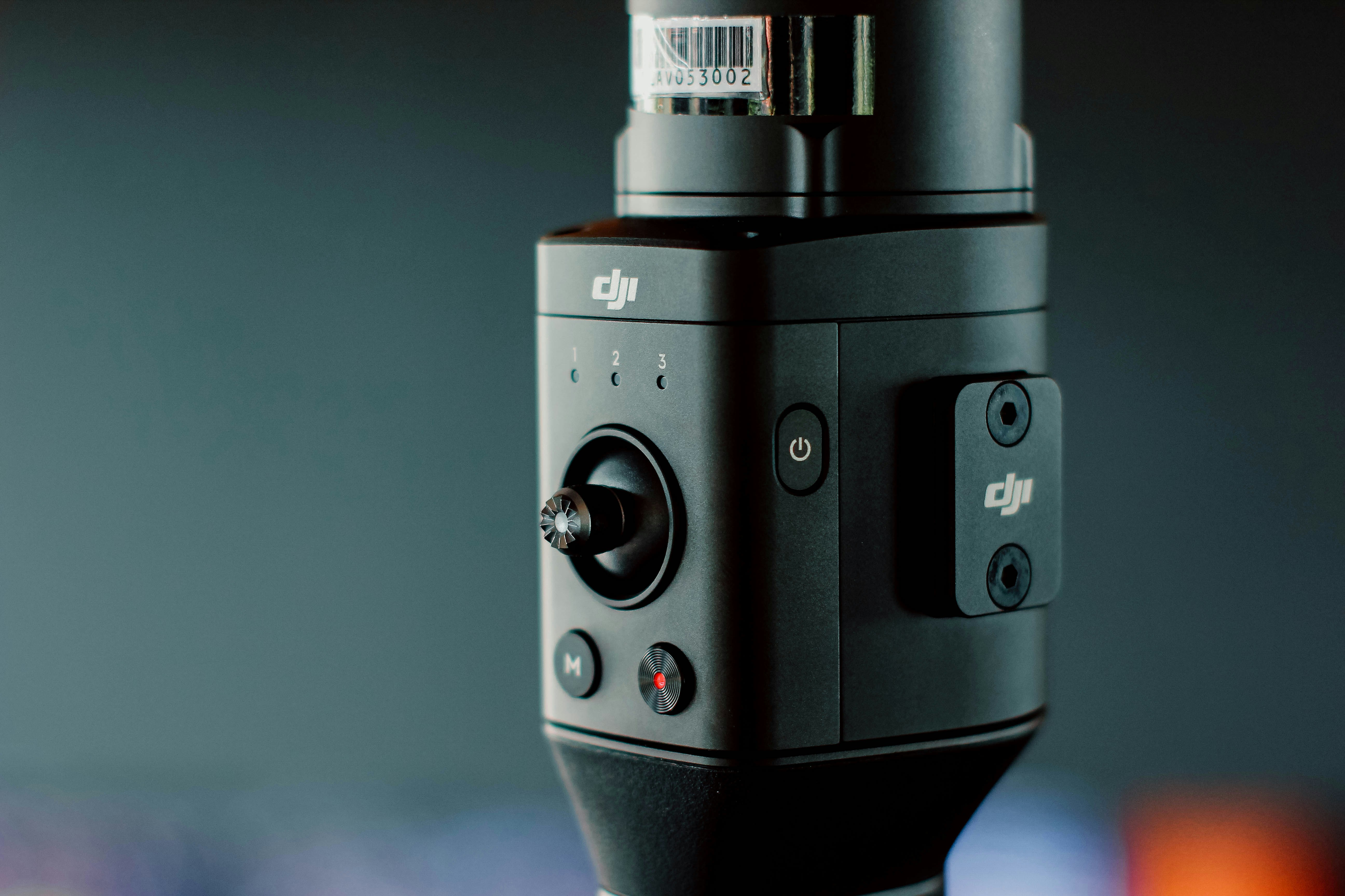 black DJI Osmo control buttons in selective focus photographt