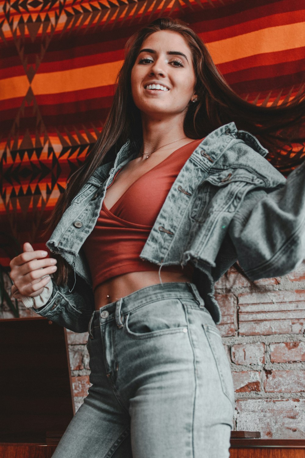 shallow focus photo of woman in blue denim jacket