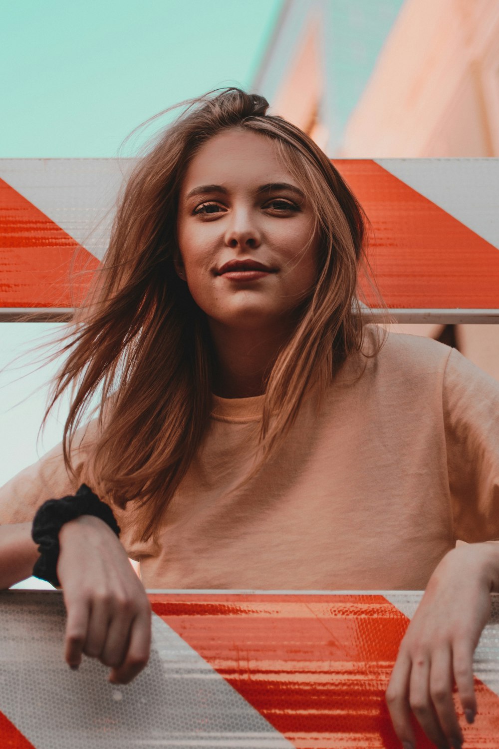 shallow focus photo of woman in brown crew-neck shirt