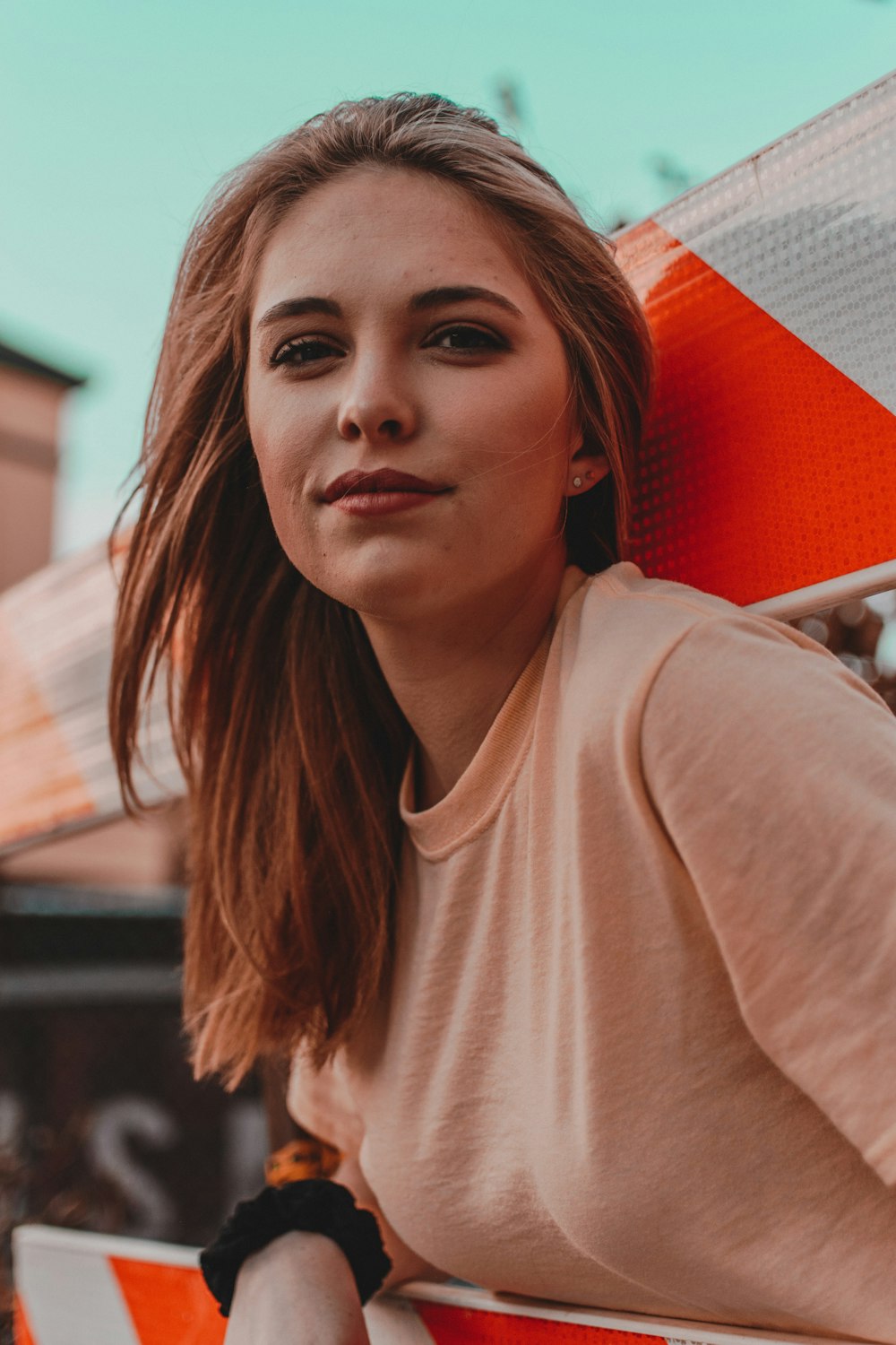 woman wearing orange top