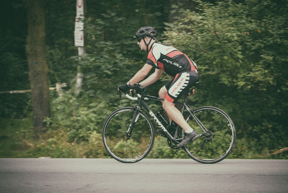 cyclist riding bicycle on road