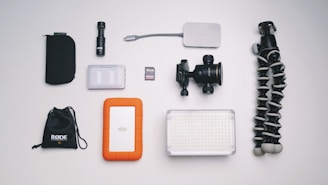 black tripod on white surface