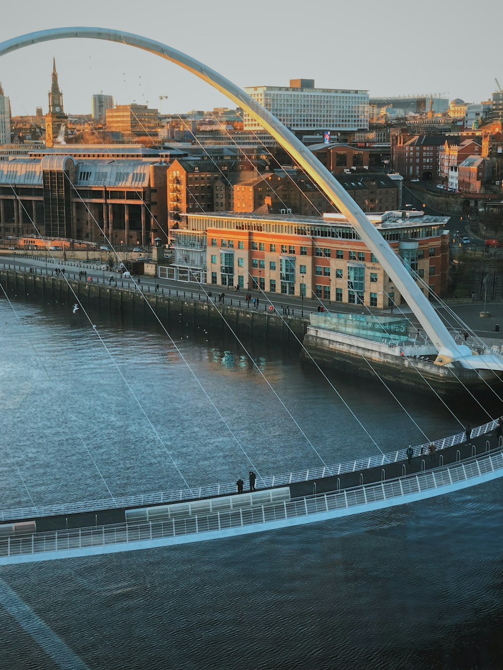 people on concrete bridge