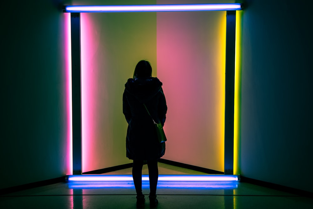 woman standing inside dark room