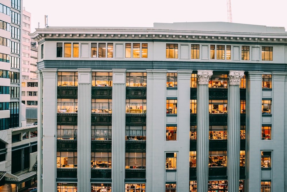 concrete building with glass windows during day