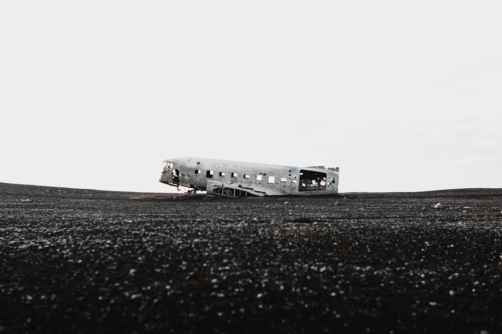greyscale photo of wrecked airplane
