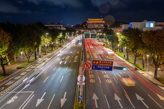 vehicles on road at night in Fine Arts Park Taiwan