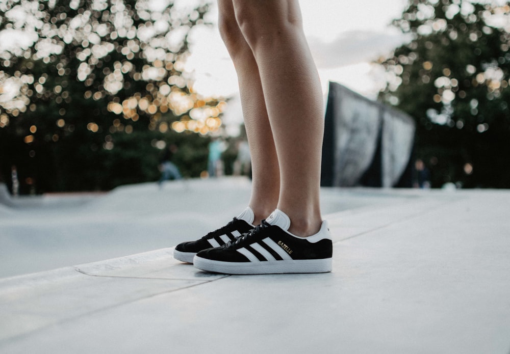 black adidas low-top sneakers