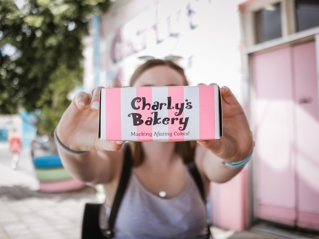 woman holding Charly's Bakery box