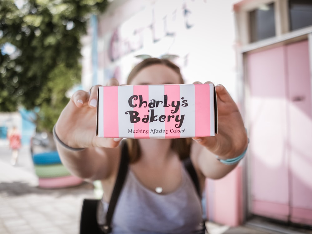 woman holding Charly's Bakery box