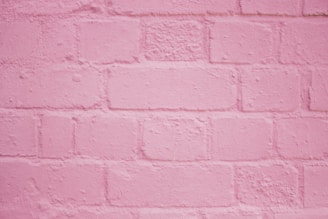 pink painted brick wall
