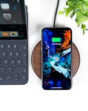 smartphone on wireless charging case at 83 percent charge