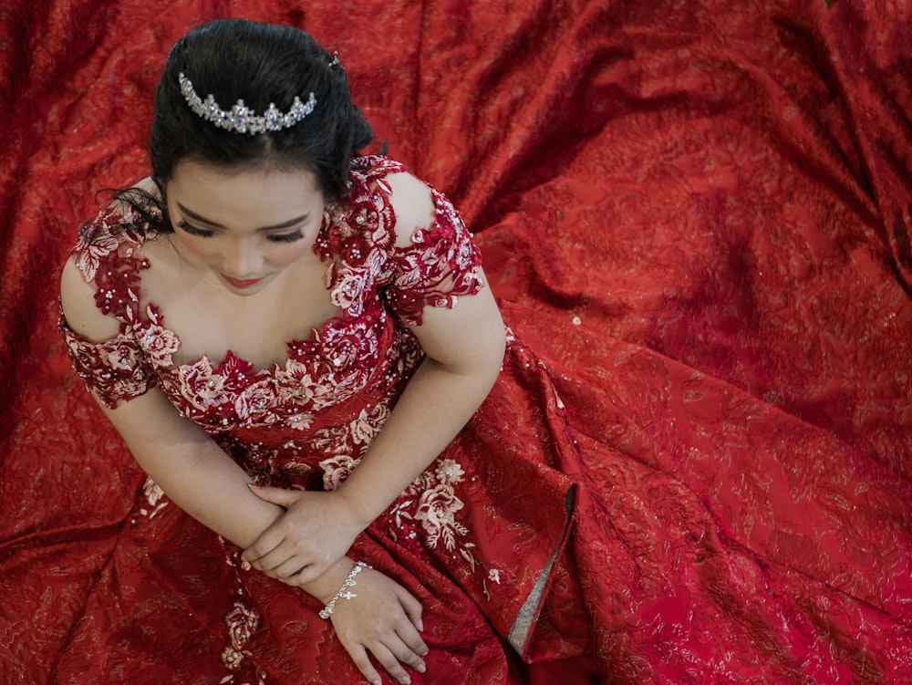 woman wearing red and white floral dress