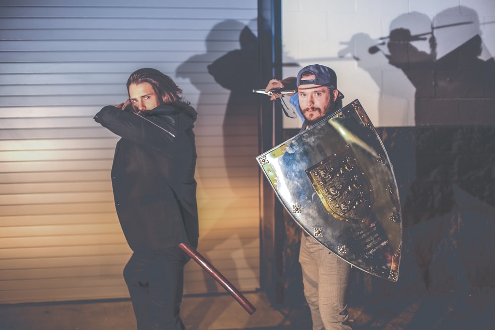 man holding sword and shield