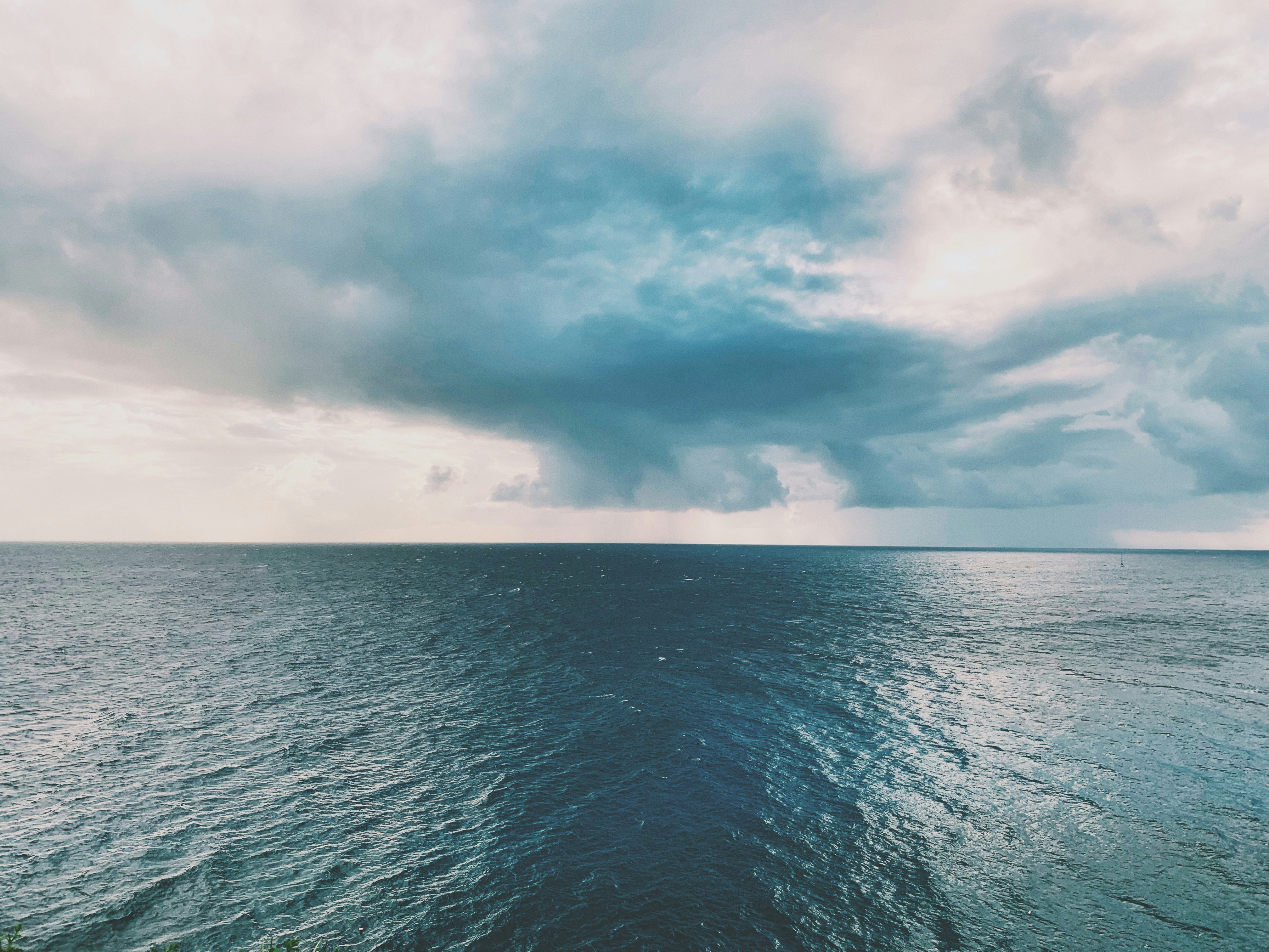 calm water at daytime antigua and barbuda teams background
