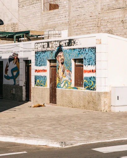 establishment with doors, window, and graffiti