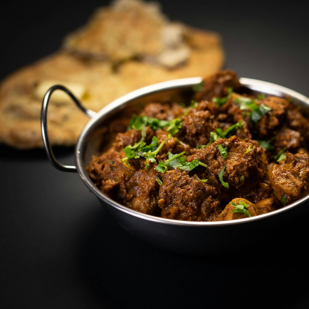 cooked food in stainless steel bowl