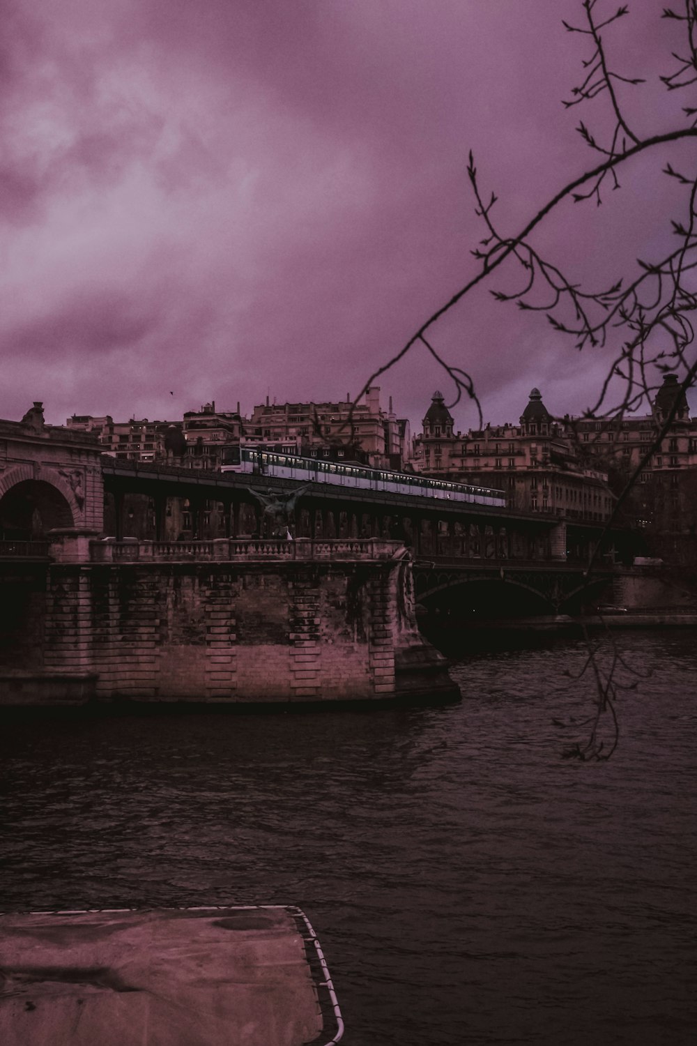 concrete bridge under gray sky at daytime