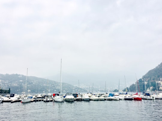 boats on calm body of water in Como Italy