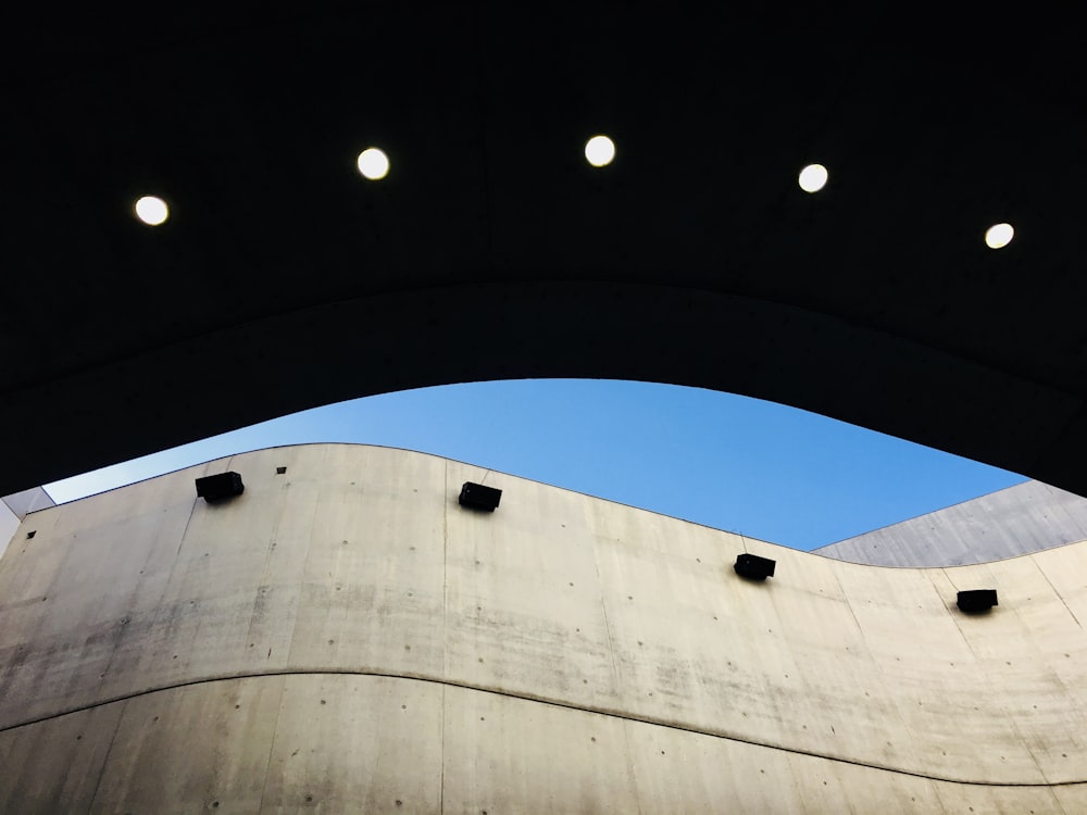 low-angle photography of gray concrete building during daytime