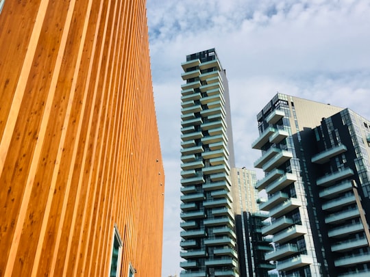 gray concrete high rise buildings in Piazza Gae Aulenti Italy