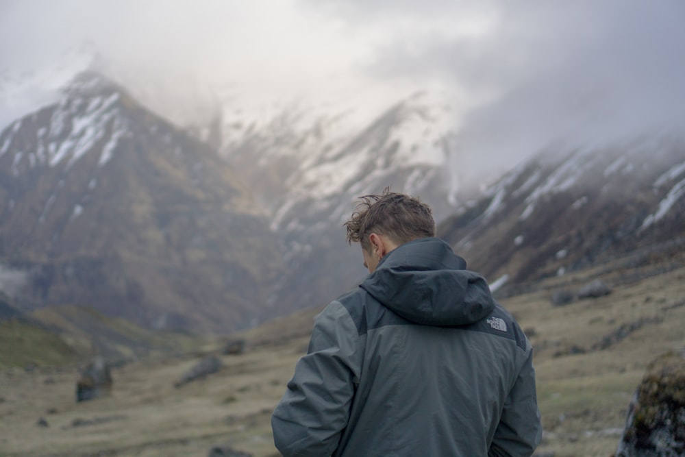 man facing mountain