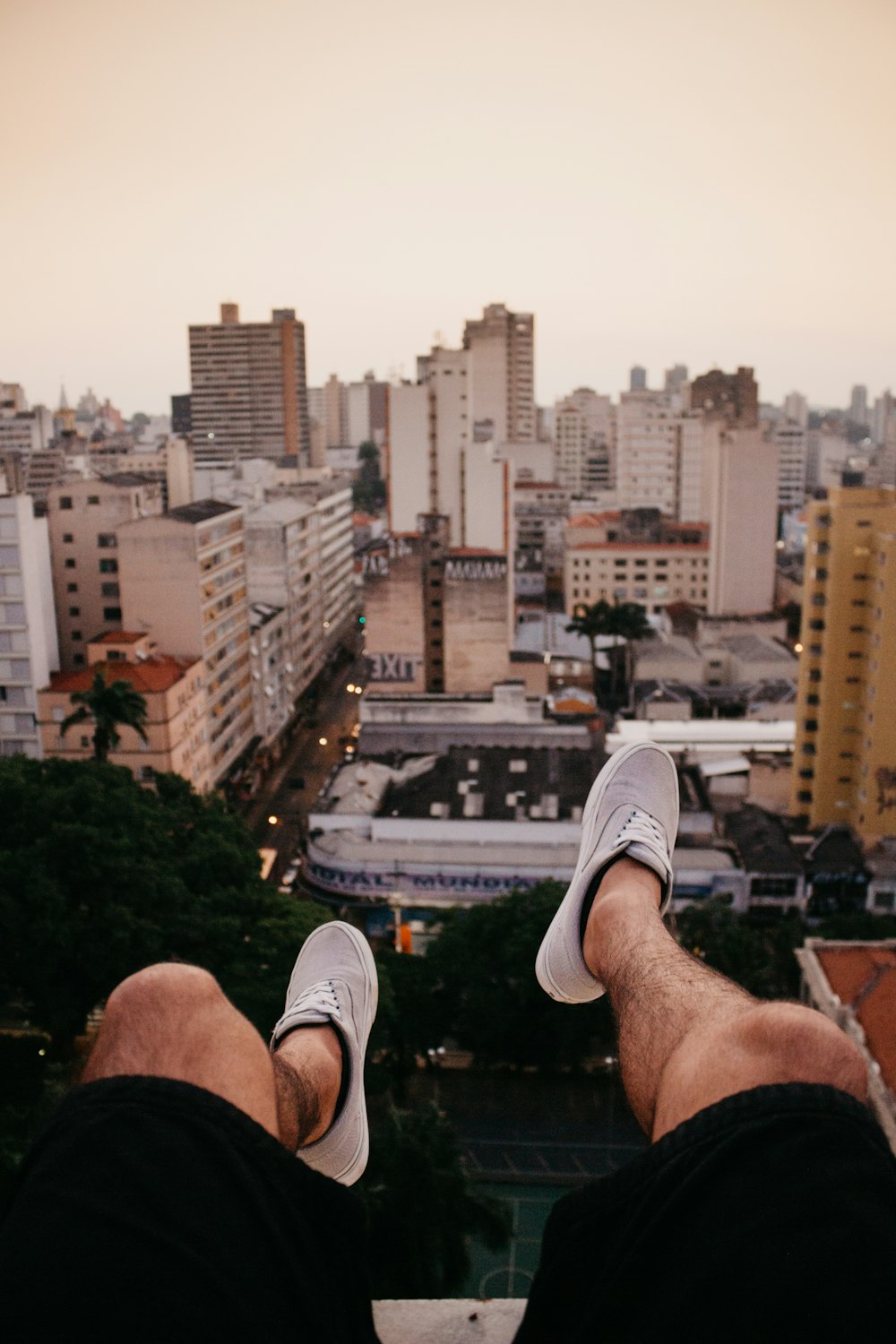 person pair of wearing gray sneakers