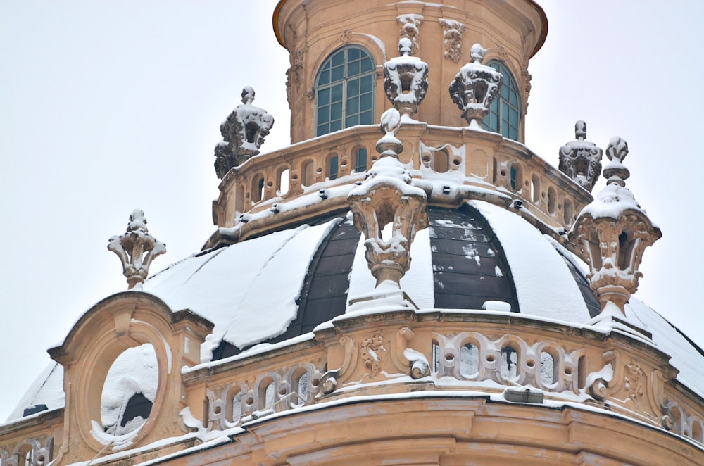 snow covered brown building