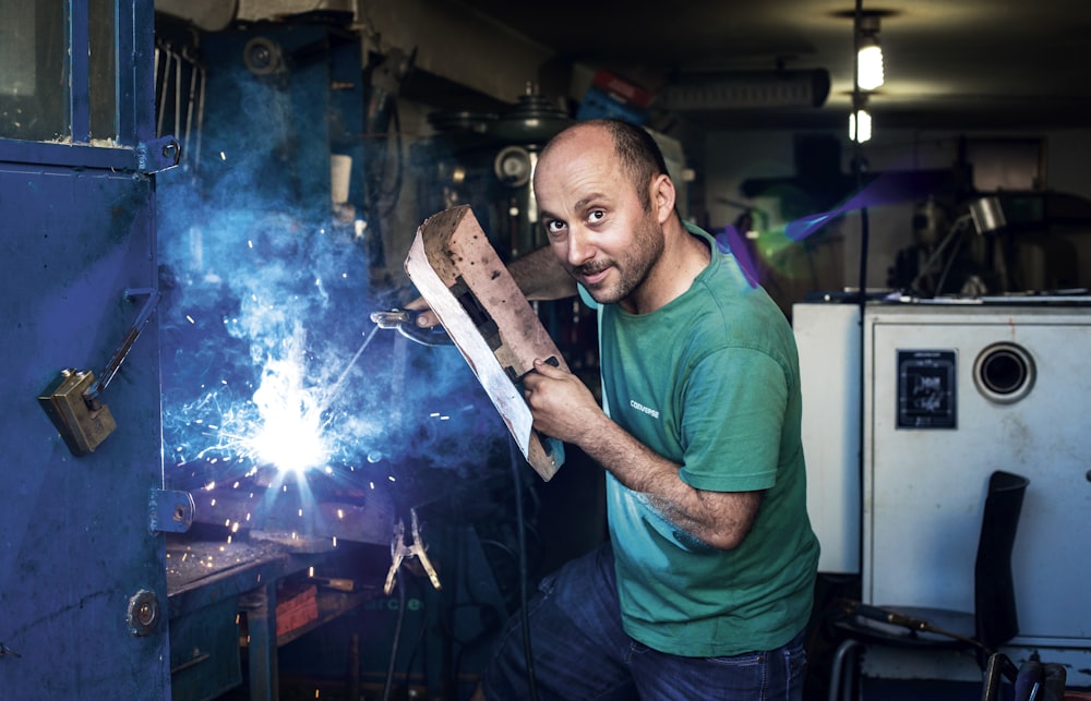 man holding welding mask