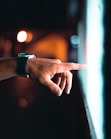 person pointing through window