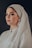 woman wearing white dress and white hijab scarf