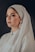woman wearing white dress and white hijab scarf