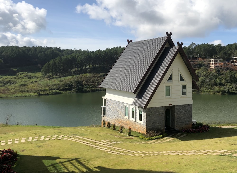 white and gray house near body of water