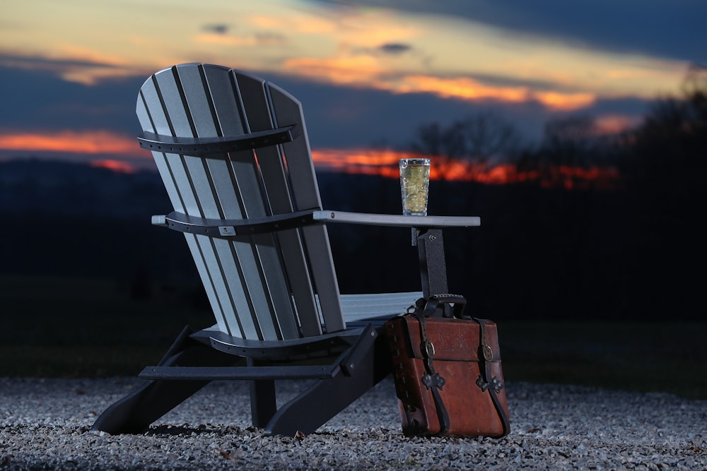 gray wooden armchair beside brown bag during golden hour